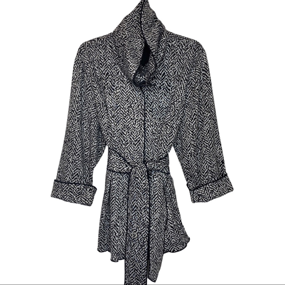 Carole Little 3/4 sleeve zebra print sweater jacket with snap enclosures.